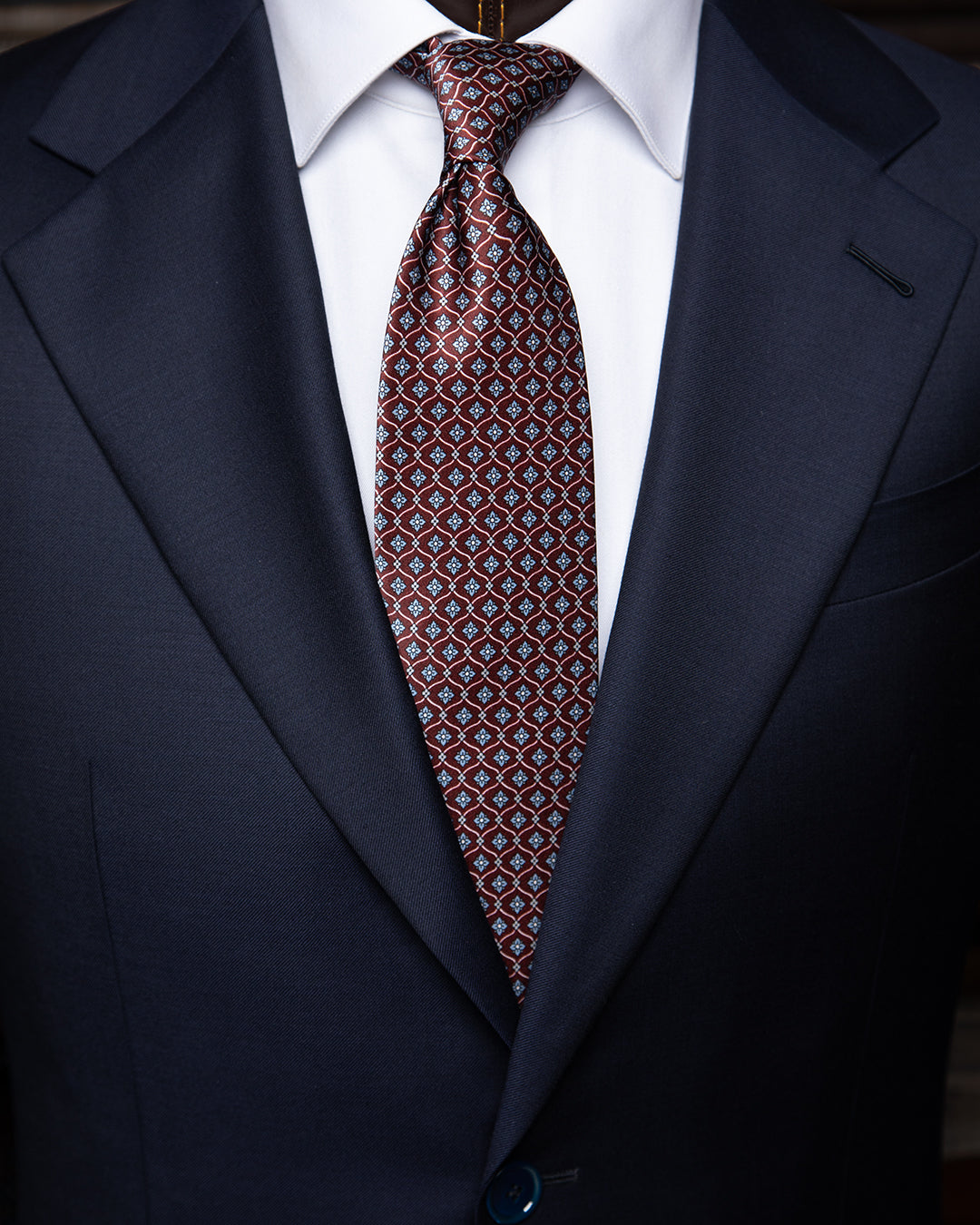 Plum Tie with Geometric Lattice and Light Blue Micro-Rosette