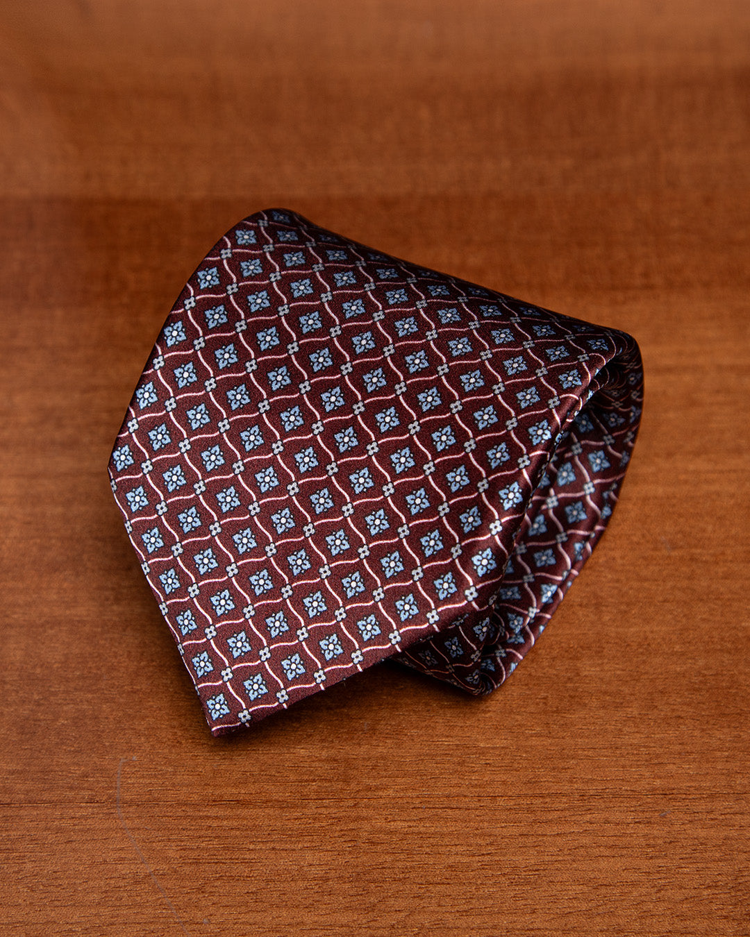 Plum Tie with Geometric Lattice and Light Blue Micro-Rosette