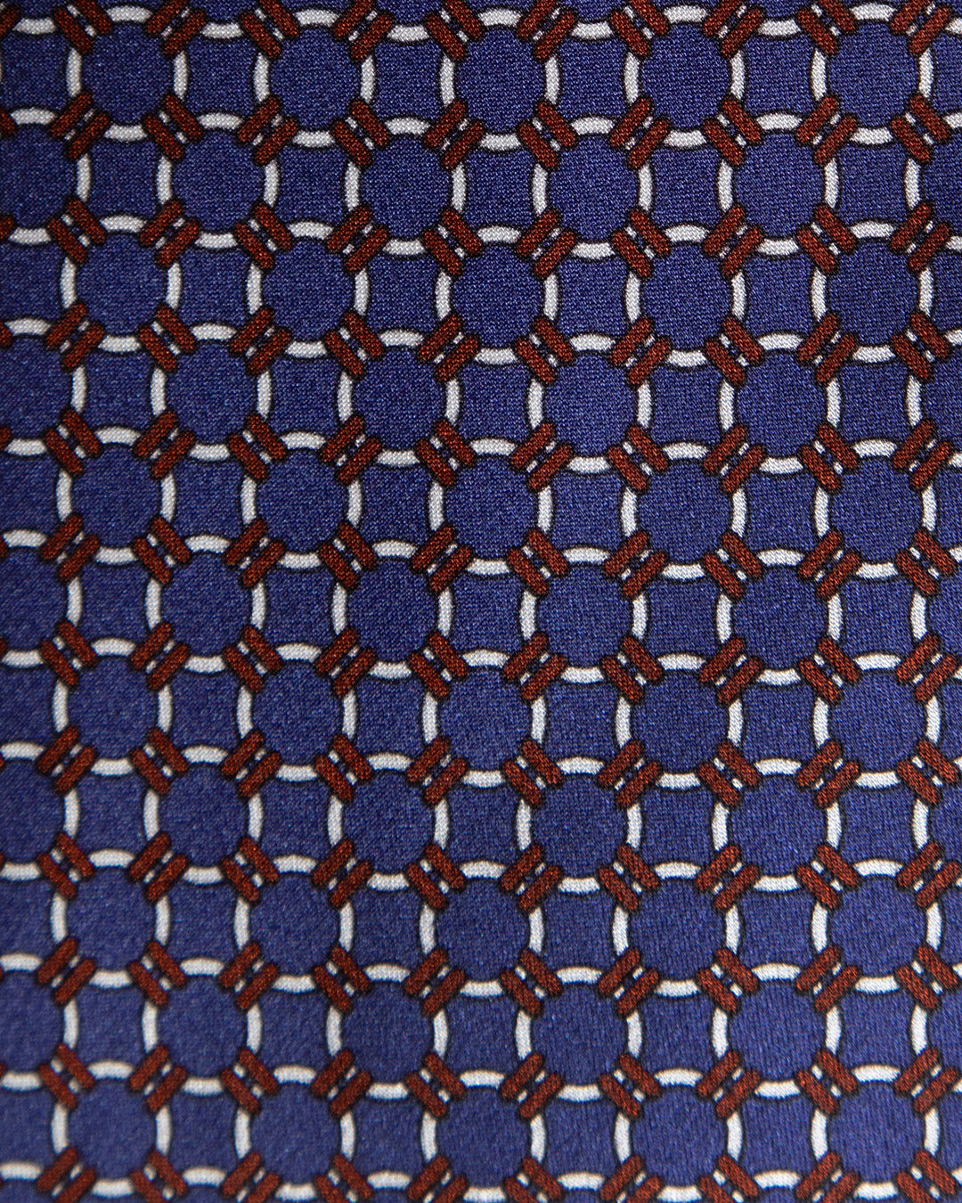 Cravatta Blu con Anelli Bianchi e Dettagli Bronzo