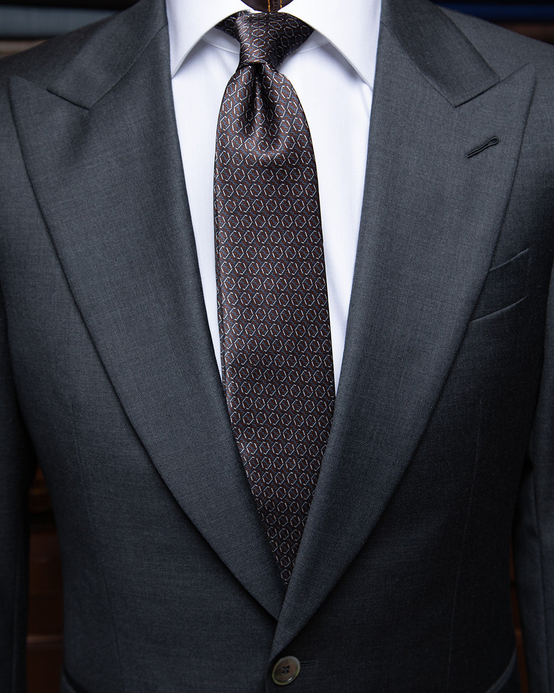 Brown and Blue Tie with Hexagonal Ring Geometry