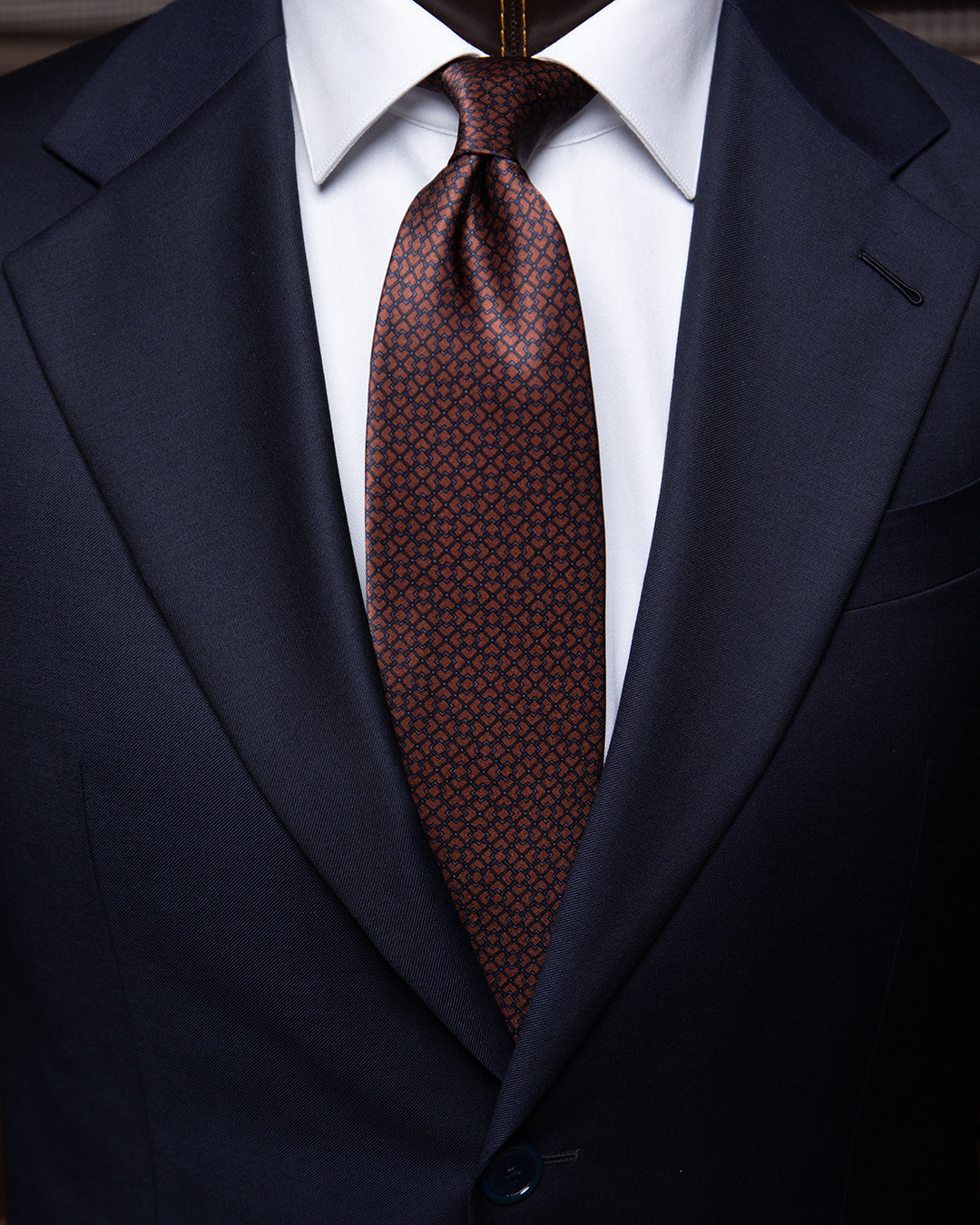 Cravatta Rame e Blu Navy con Motivo Geometrico ad Intreccio
