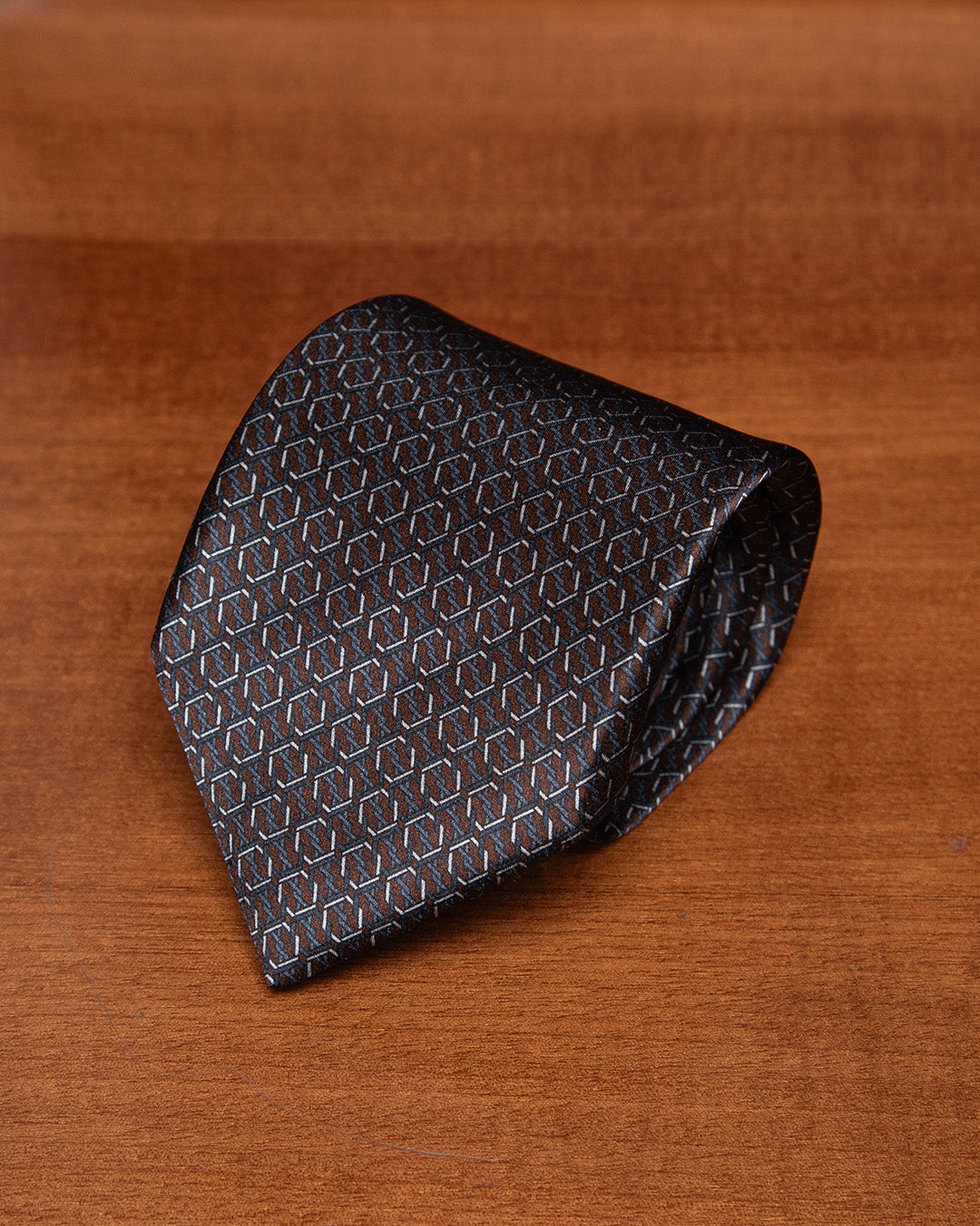 Brown and Blue Tie with Hexagonal Ring Geometry