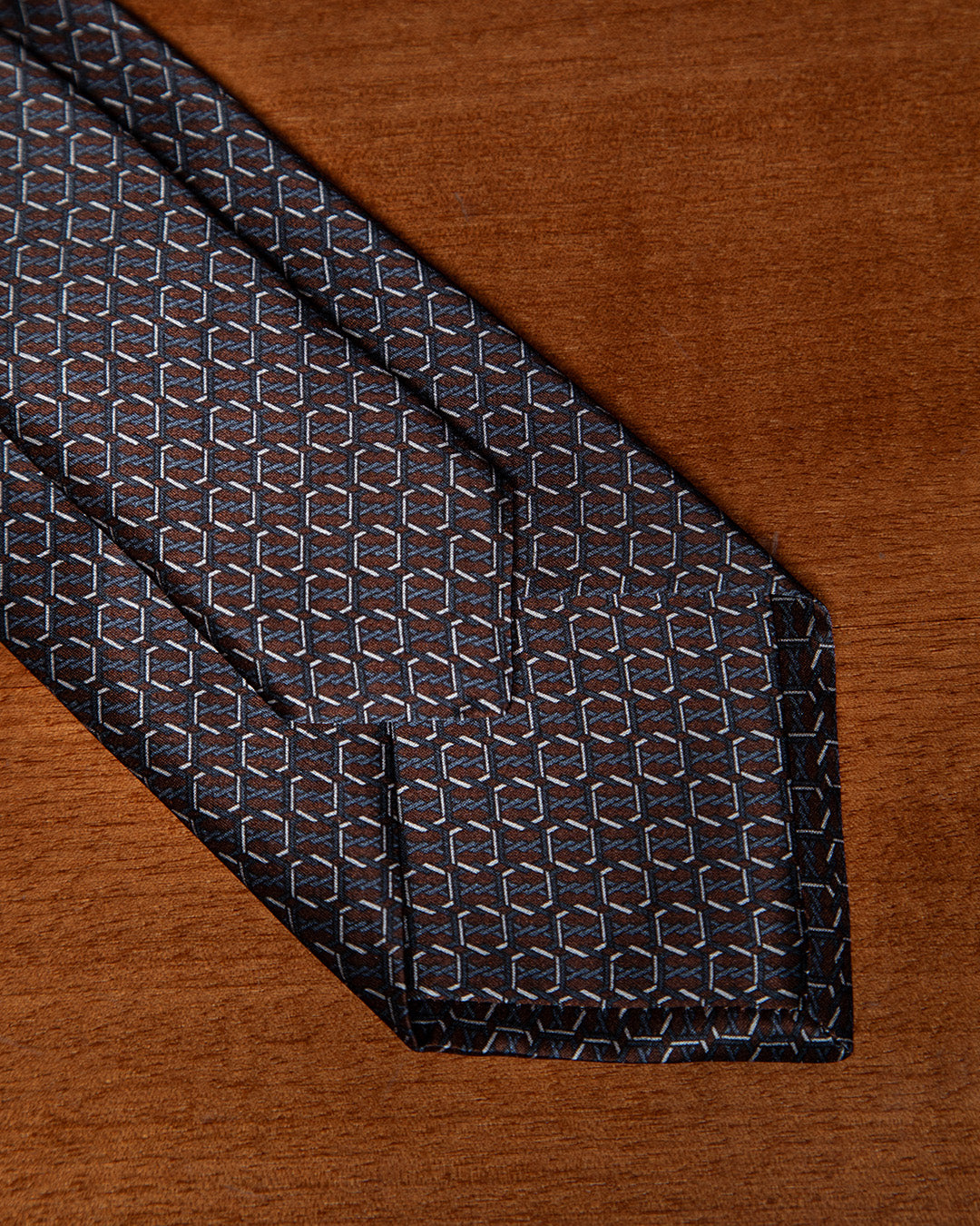 Brown and Blue Tie with Hexagonal Ring Geometry