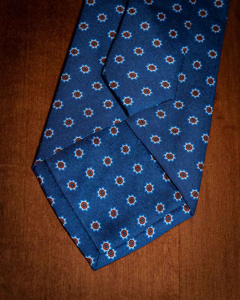 Cravatta Blu con Fiori Arancioni