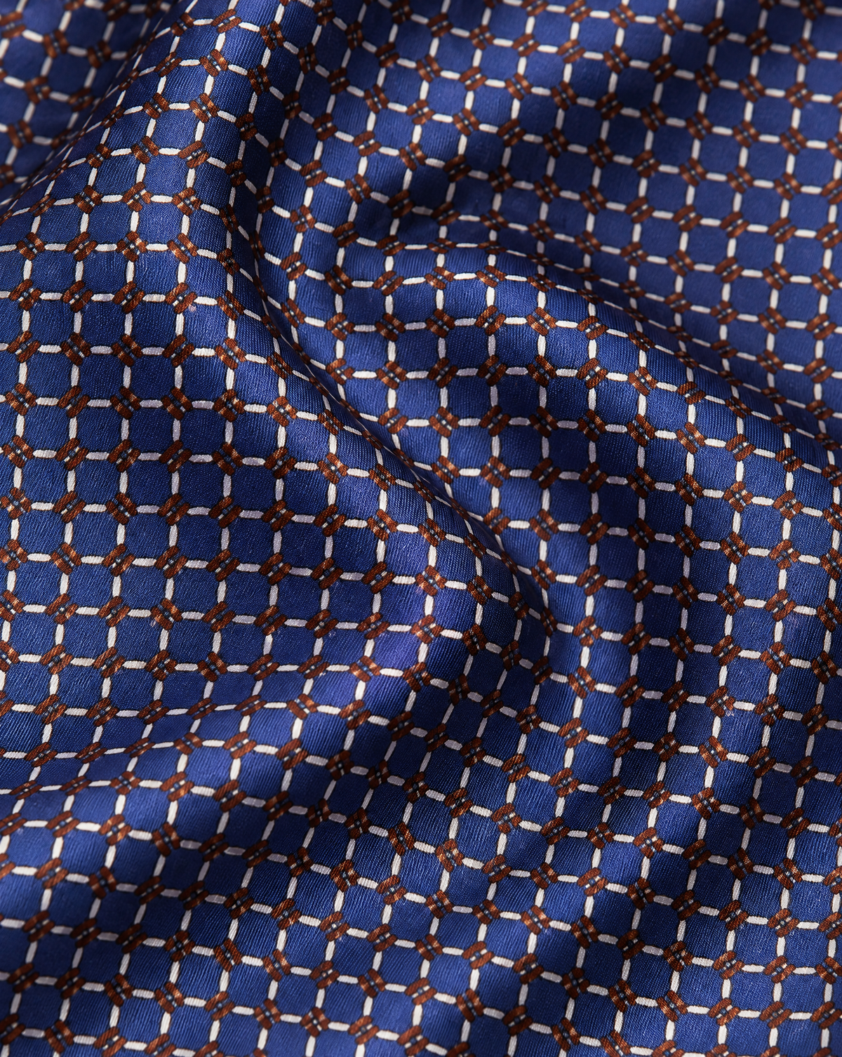 Cravatta Blu con Anelli Bianchi e Dettagli Bronzo