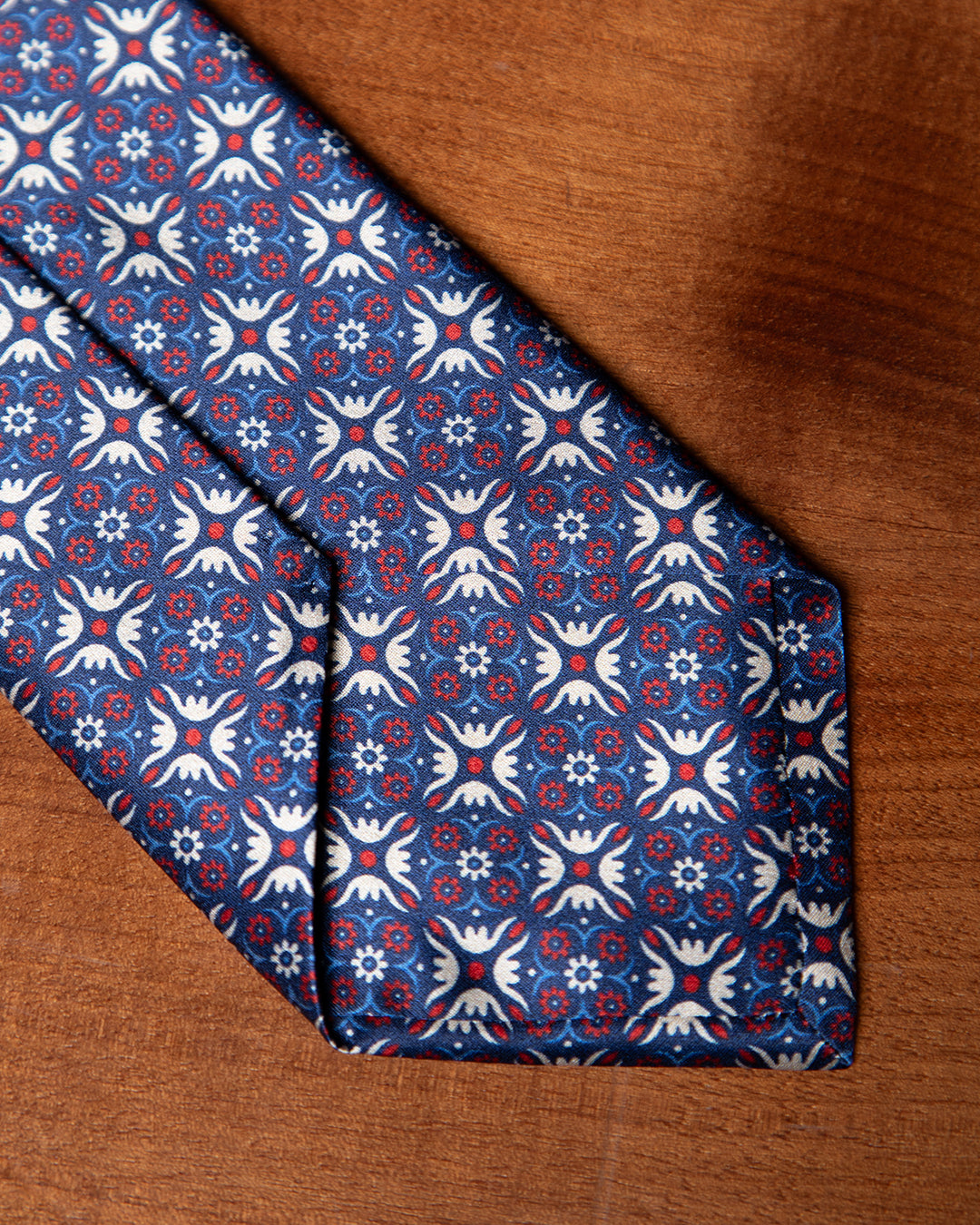 Blue Tie with Heraldic Arabesque and Ruby Accents