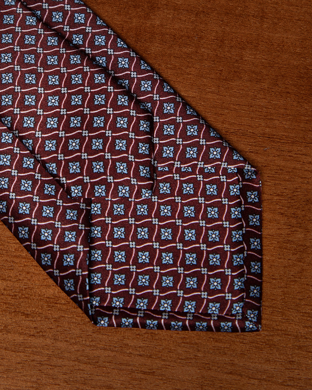 Plum Tie with Geometric Lattice and Light Blue Micro-Rosette
