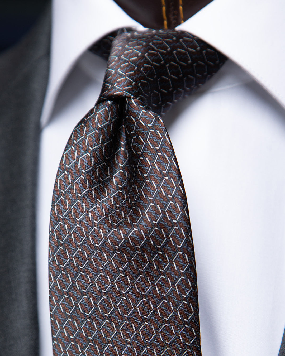 Brown and Blue Tie with Hexagonal Ring Geometry