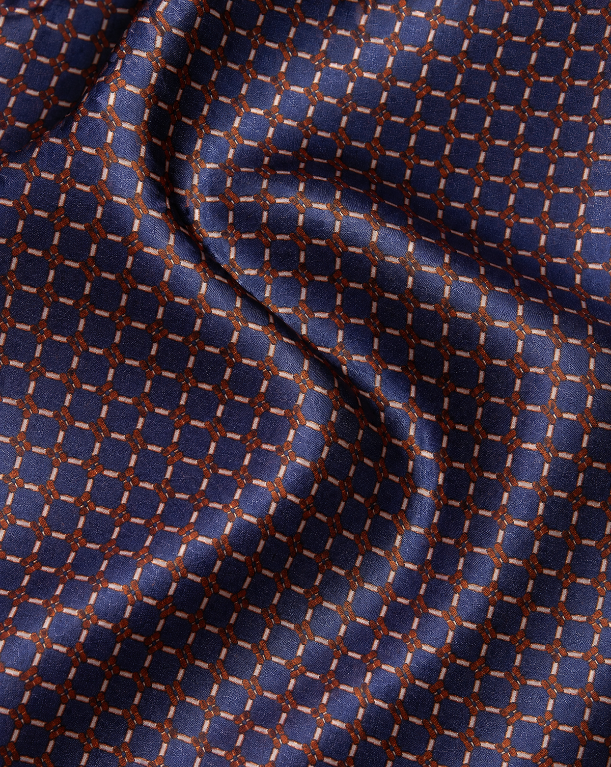 Cravatta Blu con Anelli Beige e Dettagli Bronzo